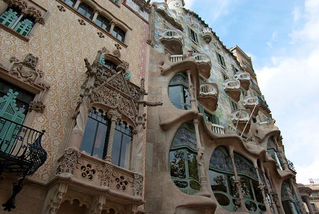 An ornate old town building, taken from the street below.