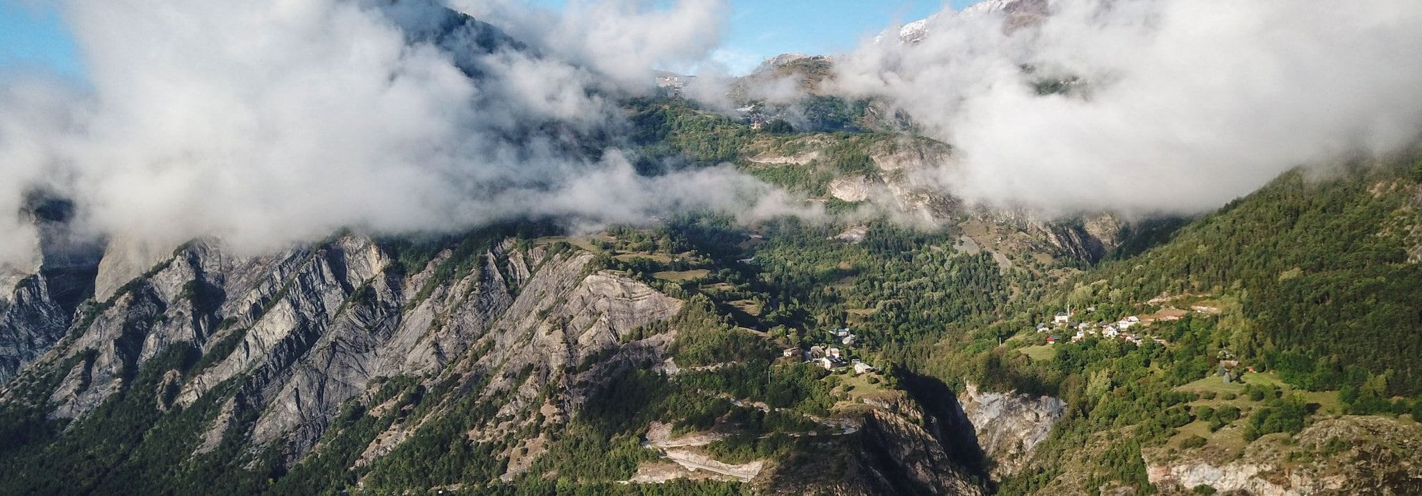 The Alpe-D'Huez mountainside is shrouded in cloud.