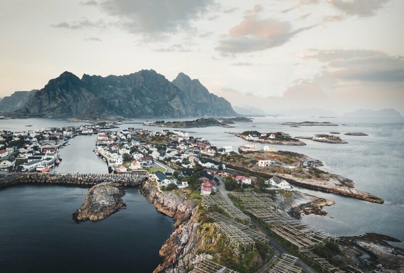 Village of Henningsvær, Norway with mountains in the background.
