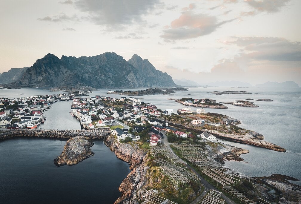 Village of Henningsvær, Norway with mountains in the background.