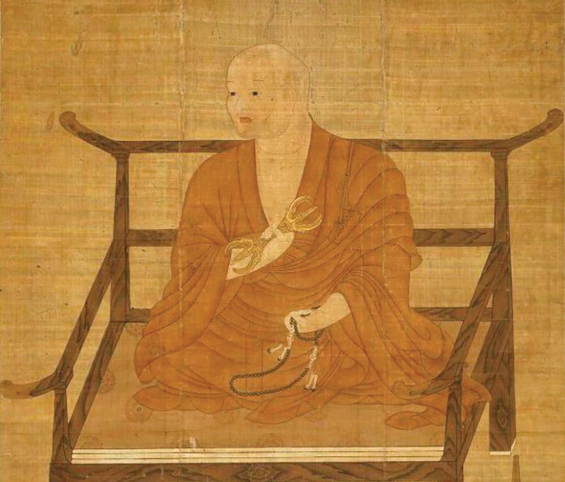 Kobo Daishi kukai seated cross-legged on a simple wooden chair.