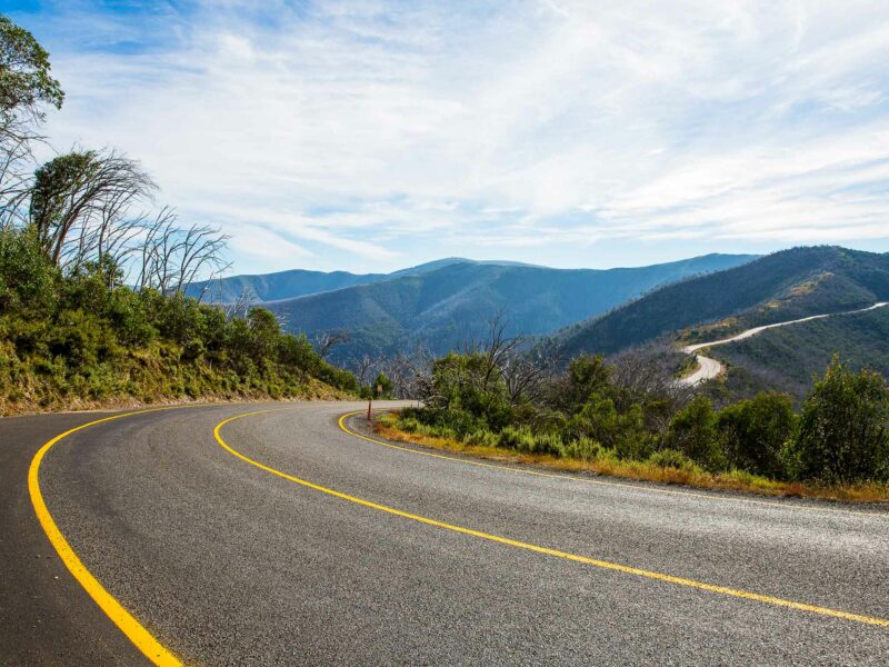View of the Great Alpine Road as it winds it's away along the top of the ridge to Hotham