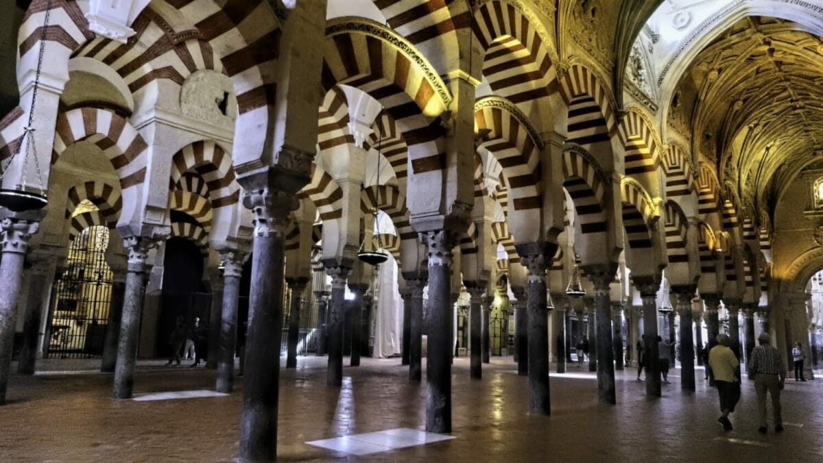 The interior of an historical building in Cordoba.. Decorative arches are the main feature