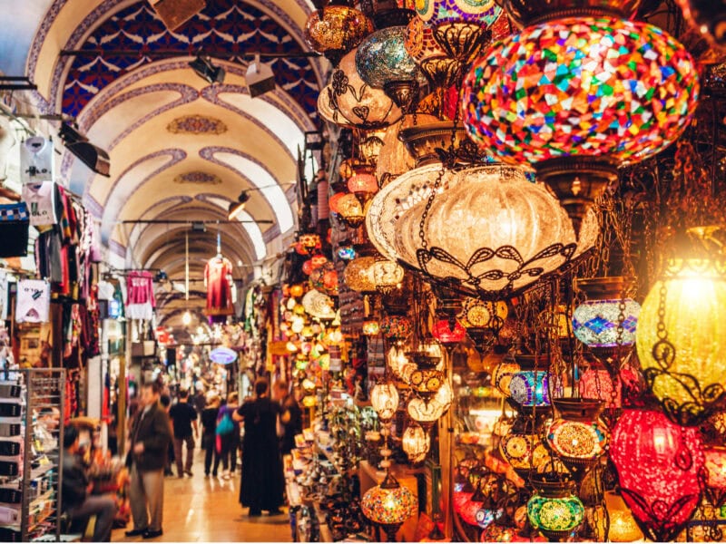 A colourful alley in a bustling Moroccan city madina.