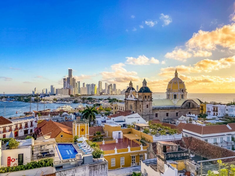 Panoramic view of Cartagena’s old city domes and rooftops blending into the modern skyline by the Caribbean Sea.