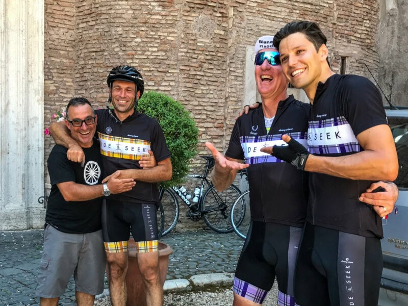 Happy cyclists arriving at their hotel
