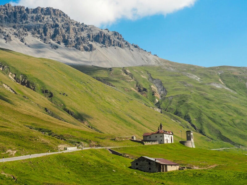 Small church on green hillside in Stelvio National Park