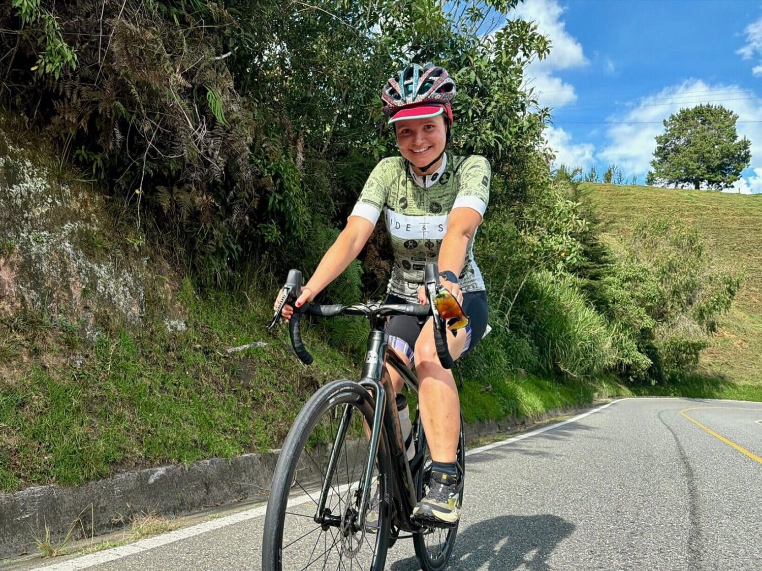 Beatrice from Ride & Seek cycling on a mountain road in Colombia, on the Bolivar cycling tour
